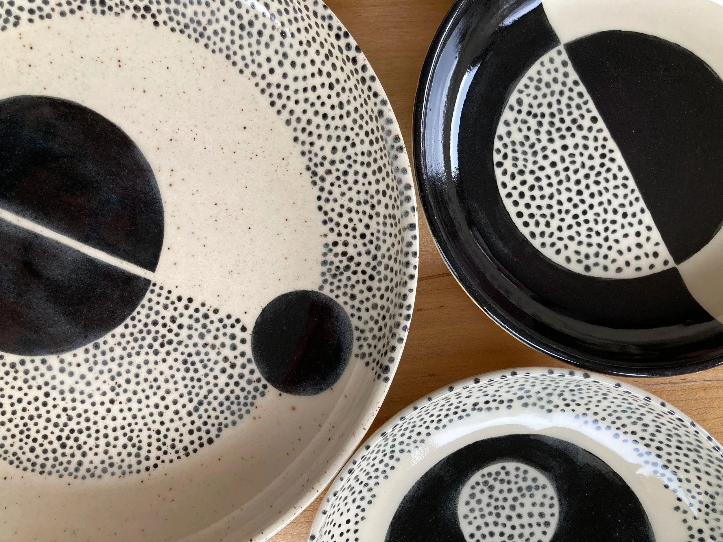 Black and white ceramic plates with dotted patterns